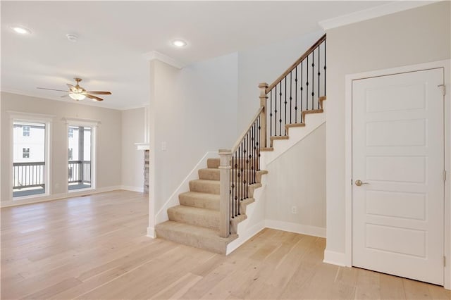7004 NE 102nd Ct, Kansas City, MO 64156 - staircase with wood finished floors, a ceiling fan, ornamental molding, and recessed lighting