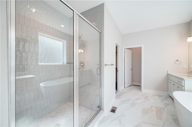 7004 NE 102nd Ct, Kansas City, MO 64156 - full bath with vanity, a freestanding tub, a shower stall, and marble finish flooring