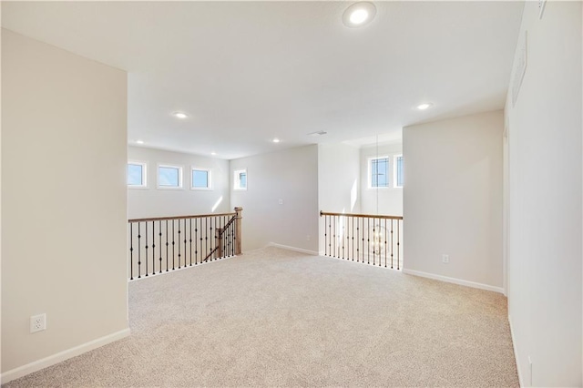 7004 NE 102nd Ct, Kansas City, MO 64156 - carpeted spare room featuring recessed lighting and healthy amount of natural light