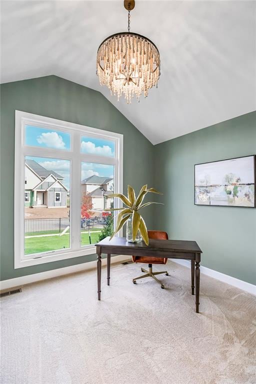 interior space featuring a wealth of natural light, lofted ceiling, and a notable chandelier