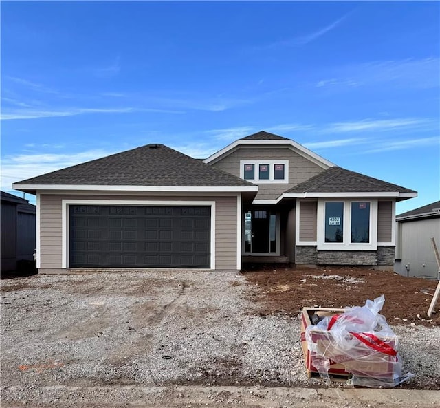 prairie-style home featuring a garage