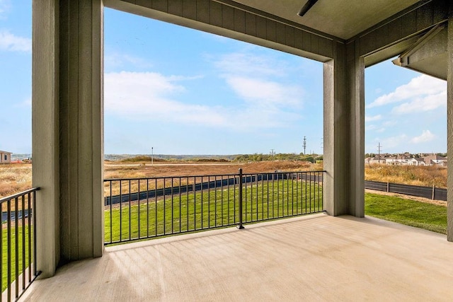 exterior space with a rural view and ceiling fan