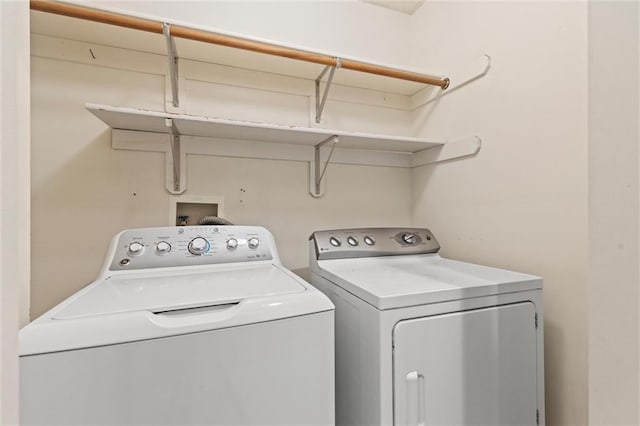 laundry area with independent washer and dryer