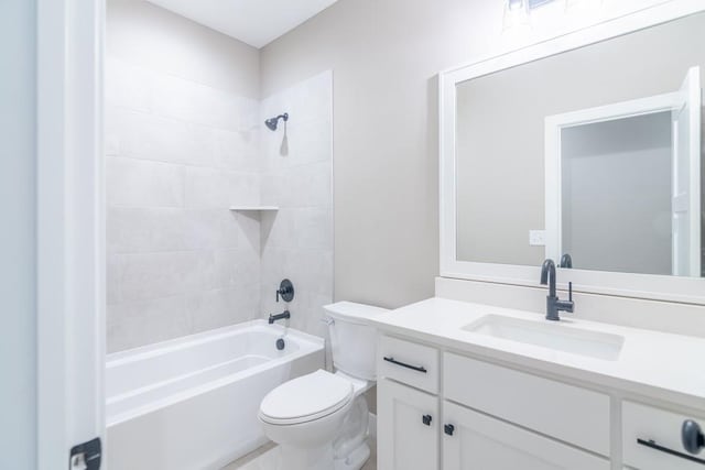 full bathroom featuring toilet, vanity, and tiled shower / bath combo