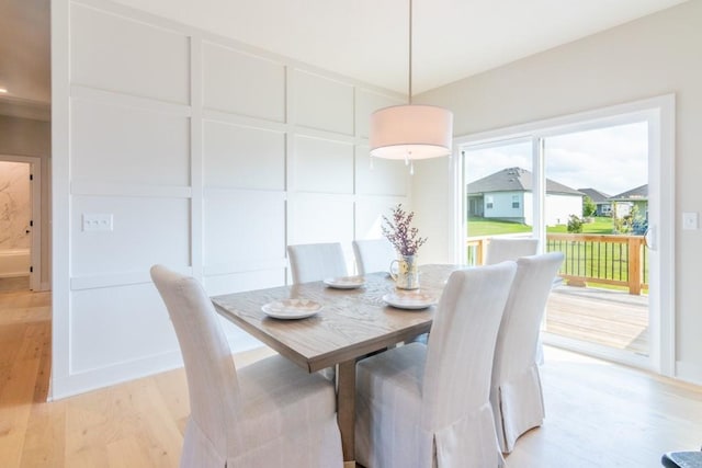 dining space with light wood-type flooring