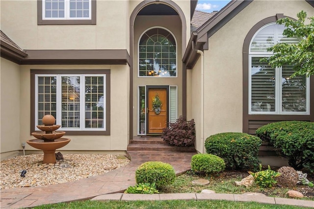 property entrance featuring stucco siding