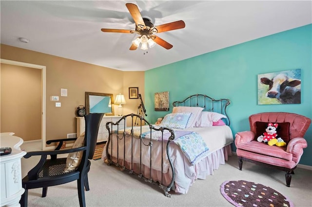 carpeted bedroom with a ceiling fan