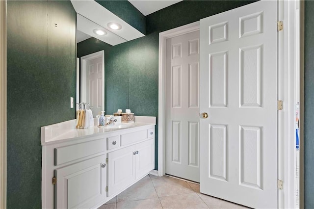 bathroom featuring tile patterned flooring and vanity