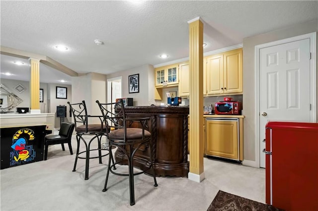 bar with a dry bar, baseboards, light colored carpet, a textured ceiling, and recessed lighting