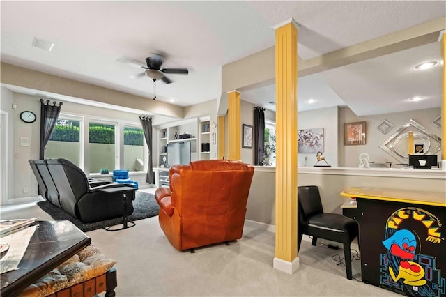 living room featuring decorative columns, baseboards, ceiling fan, carpet floors, and recessed lighting