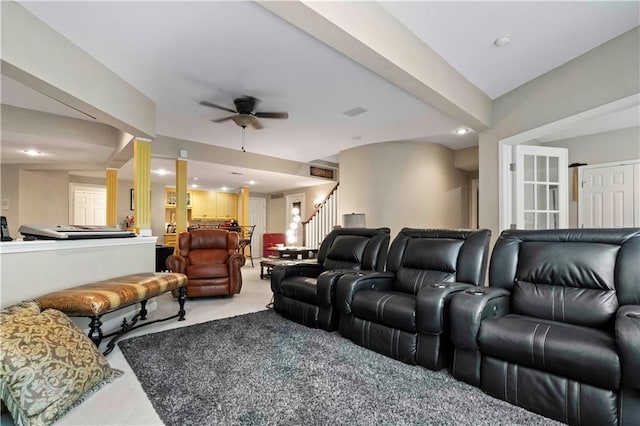 home theater room with carpet floors and ceiling fan