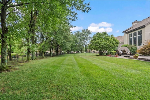 view of yard with a fenced backyard and a patio