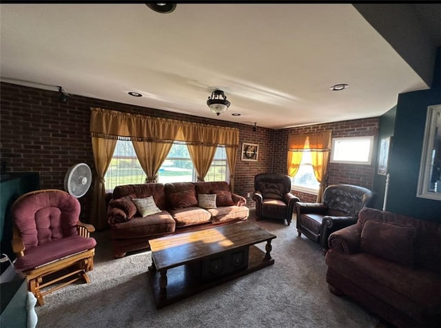 living room with brick wall and carpet flooring