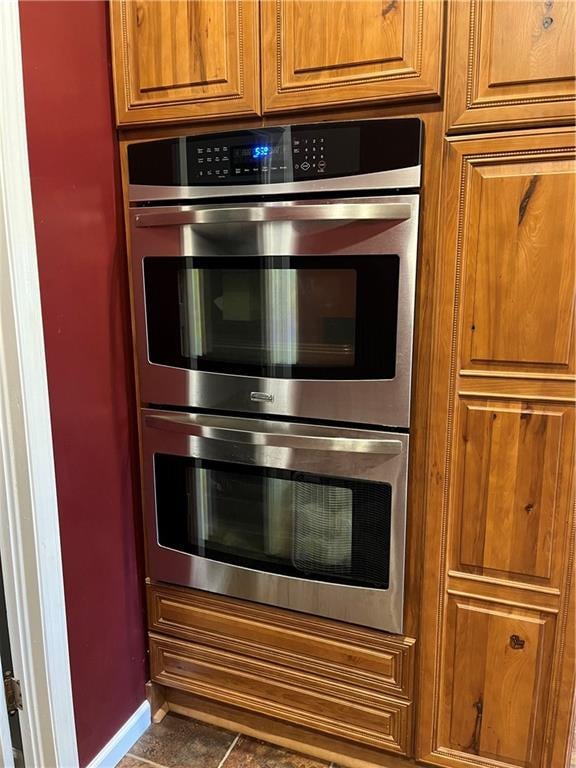 kitchen featuring double oven and tile patterned floors