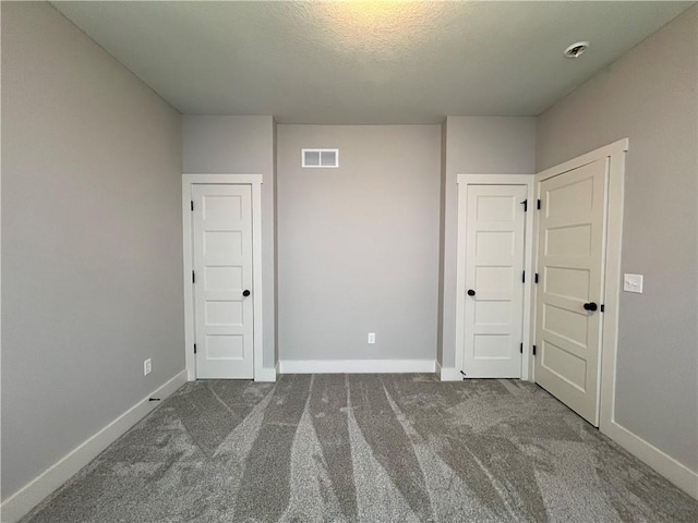 unfurnished bedroom featuring carpet flooring