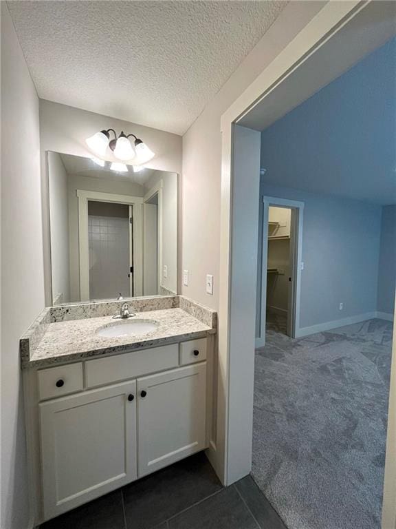 bathroom featuring vanity and a textured ceiling