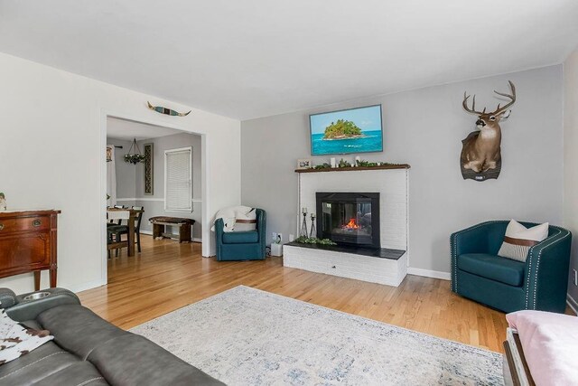 living room featuring hardwood / wood-style flooring and a fireplace