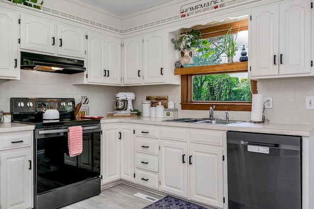 kitchen featuring crown molding, white cabinetry, stainless steel appliances, and sink