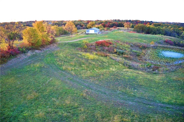 birds eye view of property with a rural view