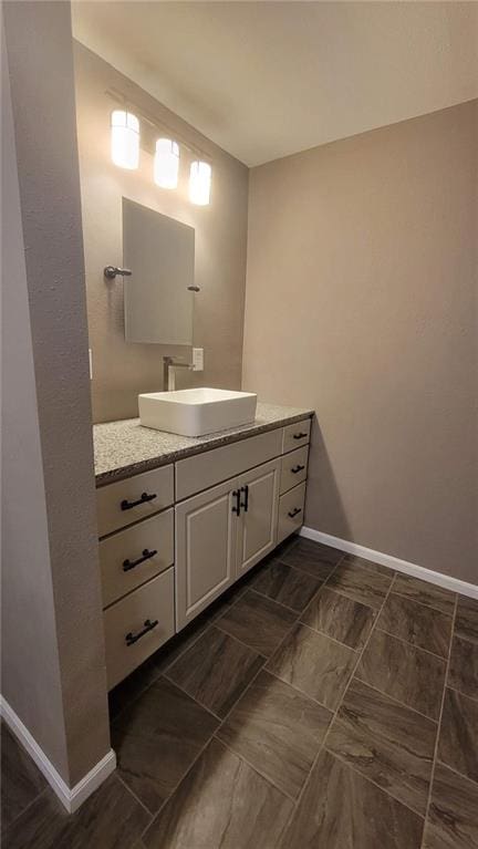 bathroom with tile patterned floors and vanity