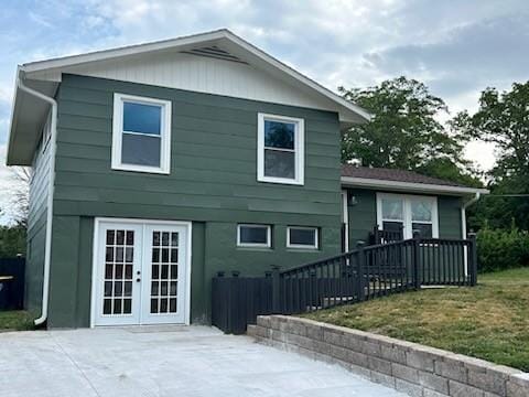 back of property featuring french doors and a patio