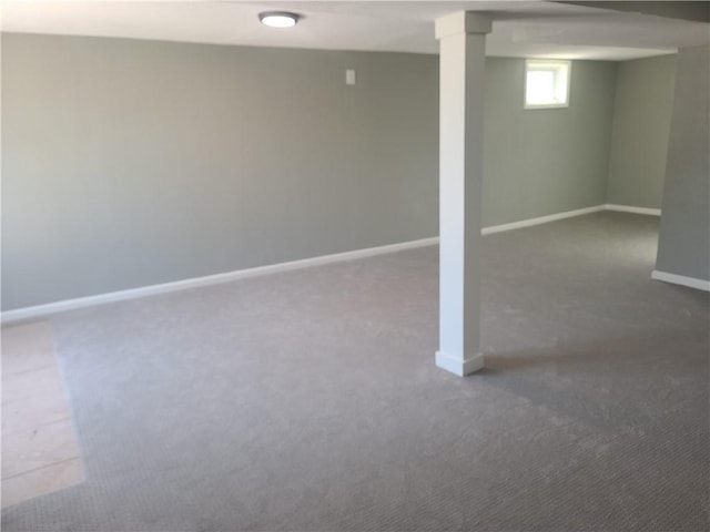 below grade area with carpet flooring and baseboards