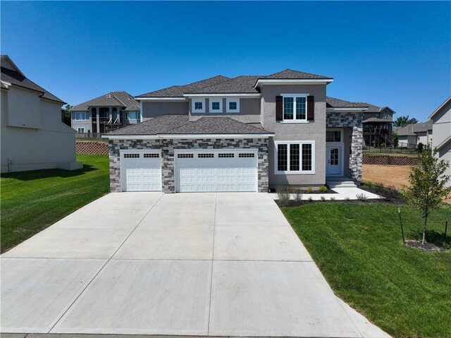 view of front facade with a front lawn and a garage