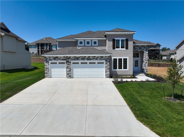 view of front of property with a garage and a front yard