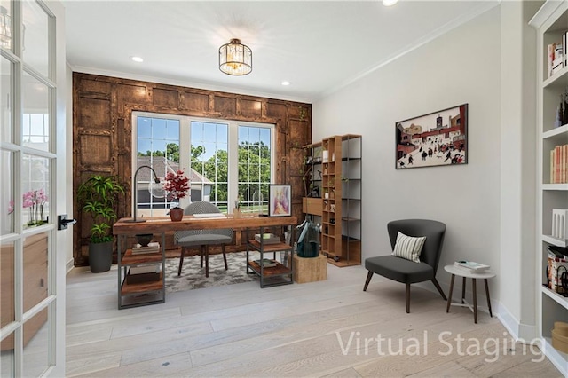 office area with ornamental molding and light hardwood / wood-style flooring