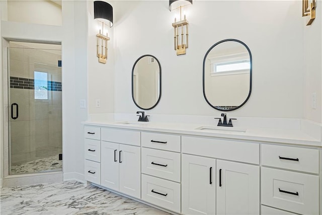 bathroom with vanity and a shower with shower door