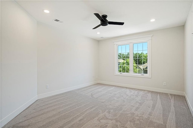 empty room with light carpet and ceiling fan