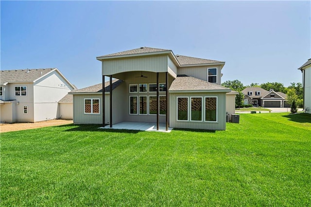 back of house with central AC, ceiling fan, a yard, and a patio area