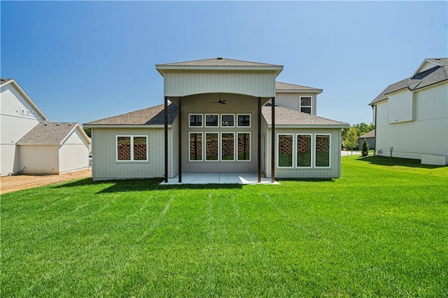 back of house featuring ceiling fan, a yard, and a patio area