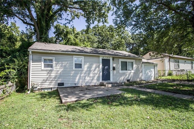 view of front facade with a patio and a front yard