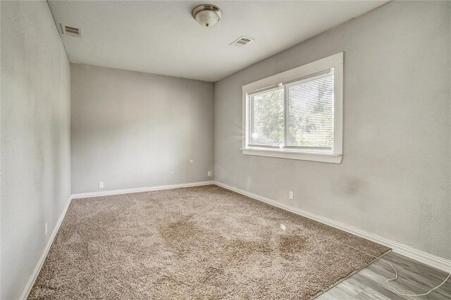 spare room featuring carpet flooring