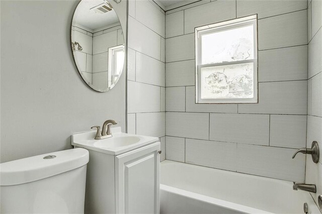 full bathroom featuring vanity, shower / bathing tub combination, and toilet