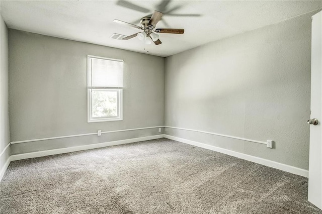 carpeted empty room featuring ceiling fan