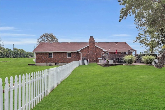 22750 Switzer Rd, Bucyrus, KS 66013 - exterior space featuring brick siding, a lawn, and a fenced backyard
