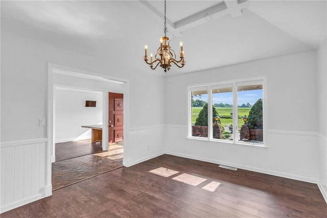 22750 Switzer Rd, Bucyrus, KS 66013 - empty room with a wainscoted wall, visible vents, an inviting chandelier, wood finished floors, and beamed ceiling
