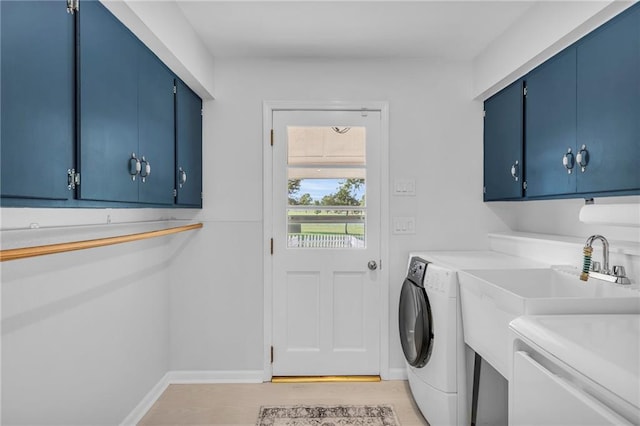 22750 Switzer Rd, Bucyrus, KS 66013 - washroom with light wood-type flooring, cabinet space, washing machine and dryer, and baseboards