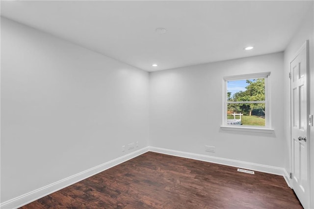 22750 Switzer Rd, Bucyrus, KS 66013 - spare room with recessed lighting, dark wood-style flooring, visible vents, and baseboards