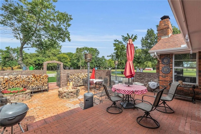 22750 Switzer Rd, Bucyrus, KS 66013 - view of patio / terrace with an outdoor fire pit
