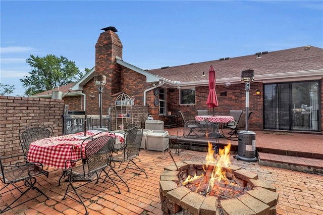 22750 Switzer Rd, Bucyrus, KS 66013 - view of patio / terrace featuring a fire pit and outdoor dining area