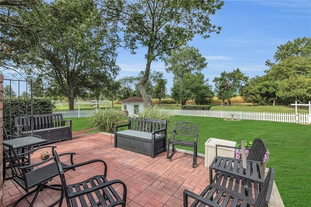22750 Switzer Rd, Bucyrus, KS 66013 - view of patio featuring an outbuilding and a fenced backyard
