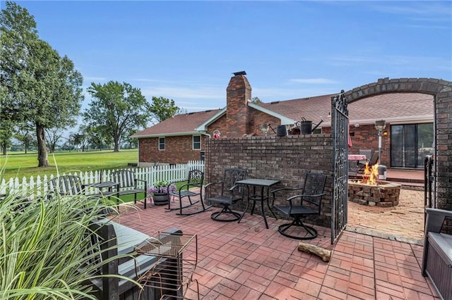 22750 Switzer Rd, Bucyrus, KS 66013 - view of patio / terrace with a fire pit and fence