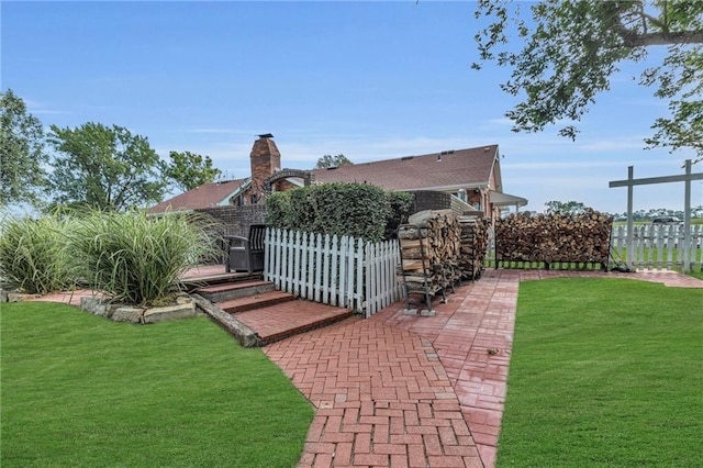 22750 Switzer Rd, Bucyrus, KS 66013 - exterior space with a lawn, a chimney, and fence