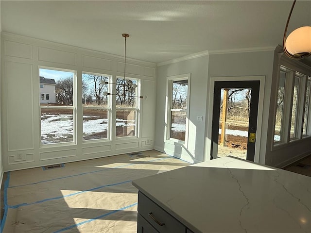 interior space with visible vents and crown molding