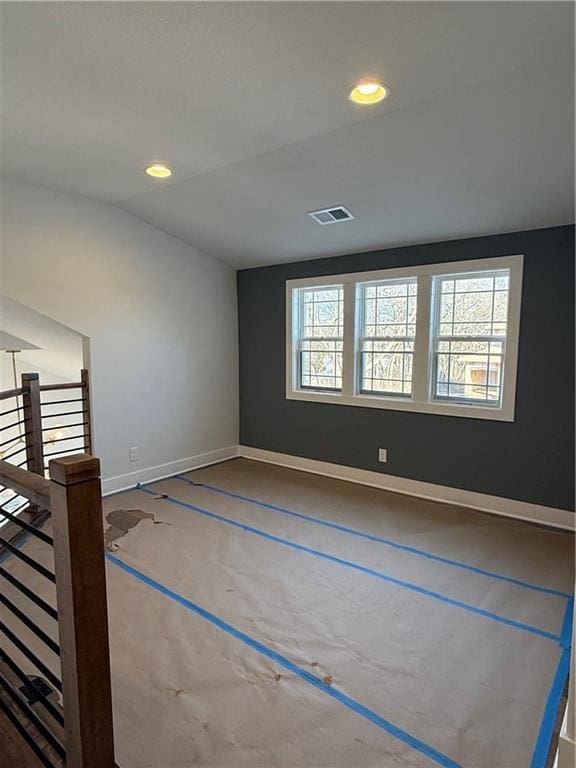 empty room featuring recessed lighting, visible vents, plenty of natural light, and baseboards