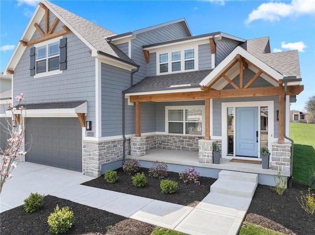 18452 Windsor St, Overland Park, KS 66085 - craftsman-style home featuring roof with shingles, a porch, stone siding, and a garage