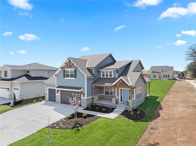 18452 Windsor St, Overland Park, KS 66085 - craftsman inspired home with a front lawn, driveway, a porch, stone siding, and a garage